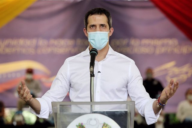 HANDOUT - 07 September 2020, Venezuela, Caracas: Venezuelan opposition leader Juan Guaido speaks during a press conference which is joined by Thirty-seven Venezuelan political parties to announce their rejection for the upcoming parliamentary elections 