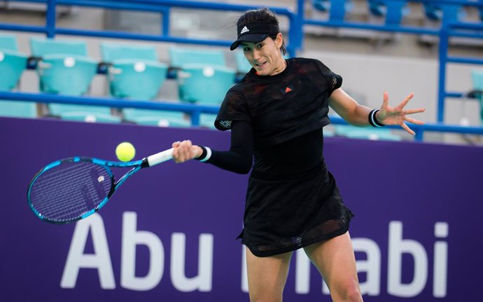 Garbine Muguruza of Spain in action during her first-round match at the 2021 Abu Dhabi WTA Womens Tennis Open WTA 500 tournament against Kristina Mladenovic of France