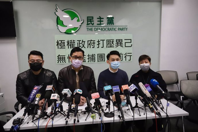 08 January 2021, China, Hong Kong: Chairman of the Democratic party Lo Kin-hei (2nd R), and former party leader lawmaker Lam Cheuk-ting speaks during a press conference at the party's headquarter to explain what had happened during detention at police s