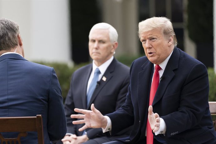 24 March 2020, US, Washington: US President Donald Trump (R)and Vice President Mike Pence (C)participate in an interview with Fox News Channel at the Rose Garden of the White House Photo: Shealah Craighead/White House via Planet Pix via ZUMA Wire/dpa