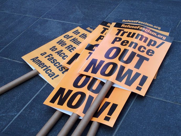 09 January 2021, US, New York: Signs can be seen on the street during a protest against US President Donald Trump in Times Square. Photo: Bruce Cotler/ZUMA Wire/dpa
