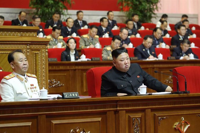 HANDOUT - 10 January 2021, North Korea, Pyongyang: A picture provided by the North Korean state news agency (KCNA) on 10 January 2021, shows North Korean Leader Kim Jong-un (R) attending the fifth day of the eighth congress of the ruling Workers' Party.