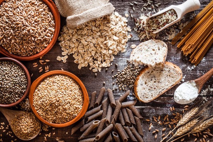 Wholegrain food still life shot on rustic wooden table