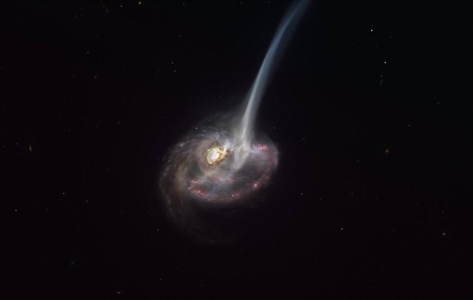 La impresión de este artista de ID2299 muestra la galaxia, el producto de una colisión galáctica, y parte de su gas es expulsado por una "cola de marea" como resultado de la fusión.