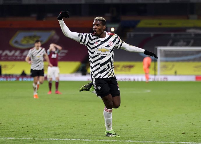 12 January 2021, England, Burnley: Manchester United's Paul Pogba celebrates scoring his side's first goal during the English Premier League soccer match between Burnley and Manchester United at Turf Moor. Photo: Clive Brunskill/PA Wire/dpa