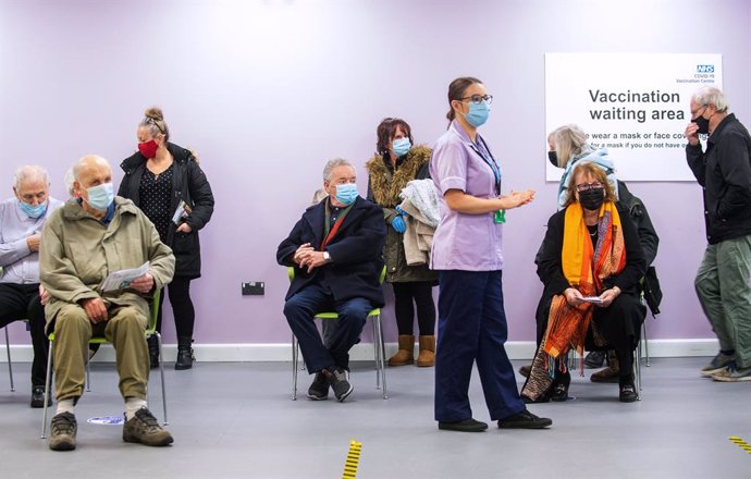 11 January 2021, England, Stevenage: People wait to receive their COVID-19 vaccine at the United Kingdom National Health Service (NHS) vaccine centre that has been set up at Robertson House. The centre is one of the seven mass vaccination centres now op