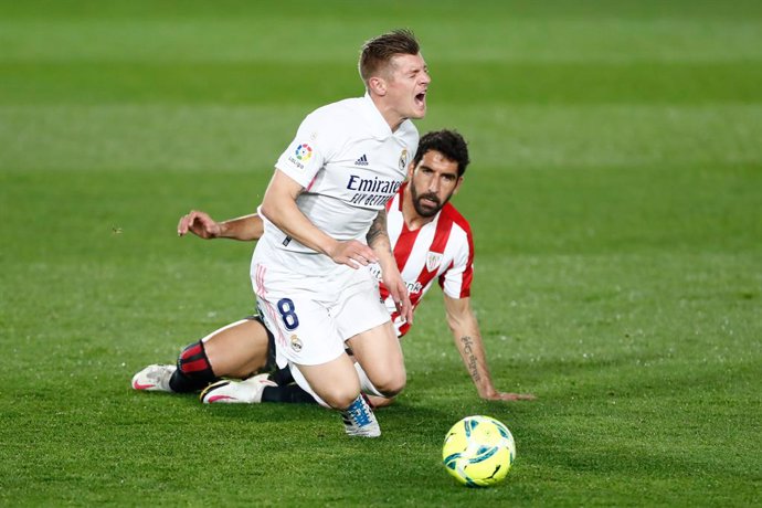 Toni Kroos of Real Madrid receives a fault from Raul Garcia of Athletic Club during the spanish league, La Liga, football match played between Real Madrid and Athletic Club de Bilbao at Alfredo di Stefano stadium on december 15, 2020, in Valdebebas, Mad