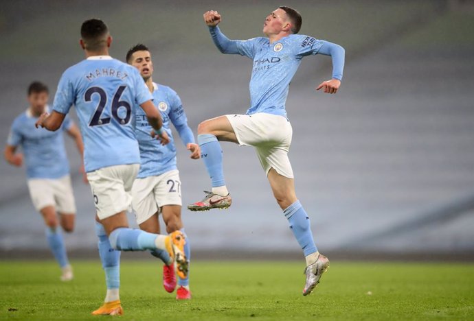 13 January 2021, England, Manchester: Manchester City's Phil Foden celebrates scoring his side's first goal during the English Premier League soccer match between Manchester City and Brighton & Hove Albion Football Club at Etihad Stadium. Photo: Clive B