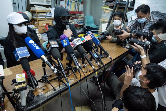 28 December 2020, China, Hong Kong: Family members of pro-democracy activists detained in mainland China hold a press conference after a Chinese court began the trial of ten of twelve Hong Kong activists who have been detained after a failed attempt to 