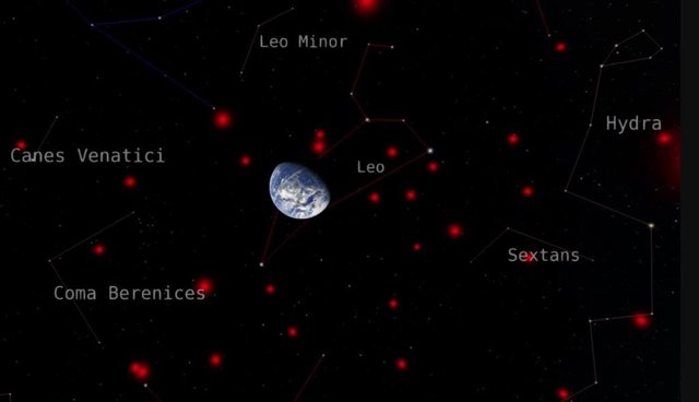 Esta imagen muestra a la Tierra rodeada por las enanas marrones más cercanas, mostradas en rojo, contra el telón de fondo de las constelaciones circundantes.