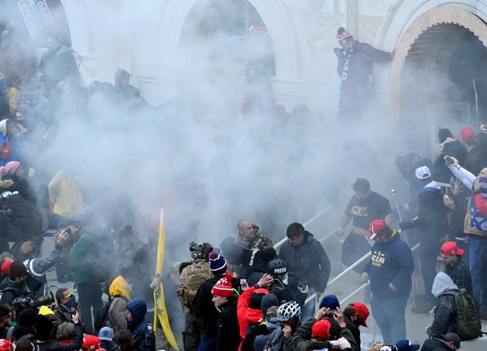 07 January 2021, US, Washington: Tear gas is fired towards supporters of US President Donald Trump as they storm the USCapitol building where lawmakers were due to certify president-elect Joe Biden's win in the November election. Photo: Essdras M. Suar
