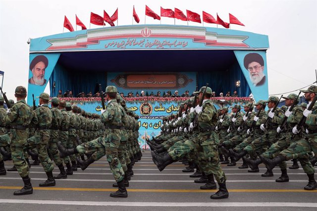 HANDOUT - 18 April 2019, Iran, Tehran: Iranian president Hassan Rouhani (C) attends the annual military parade. Iran will not be 'intimidated' by US terrorist listing and the air force, ground forces and the navy have never been as powerful as today,Ro