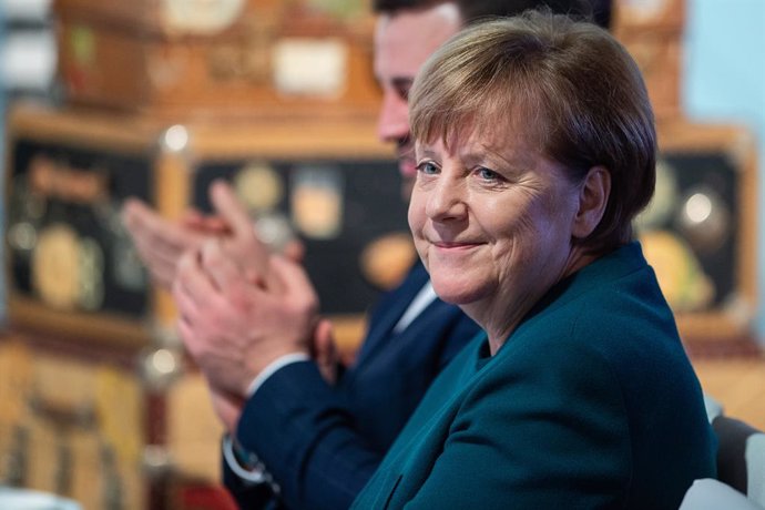 18 February 2019, Duderstadt: German Chancellor Angela Merkel smiles during an event celebrating the 100th anniversary of German prosthetics company Ottobock. Photo: Swen Pfrtner/dpa