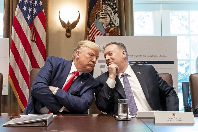 HANDOUT - 21 October 2019, US, Washington, D.C.: US President Donald Trump (L) listens to US Secretary of State Mike Pompeo during a cabinet meeting at the White House. Photo: Tia Dufour/White House/dpa - ATTENTION: editorial use only and only if the cr