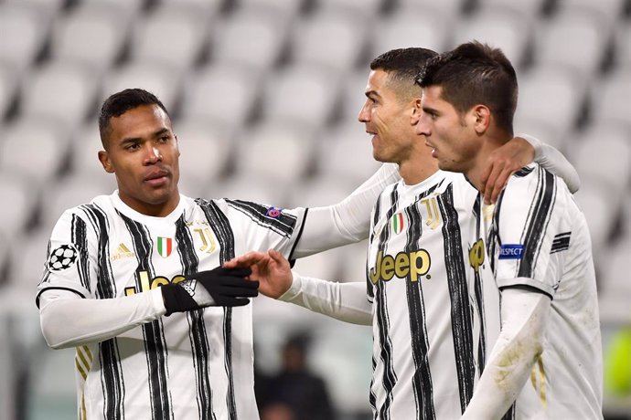 02 December 2020, Italy, Turin: Juventus' Alvaro Morata (R) celebrates scoring his side's third goal with his team mates Alex Sandro (L) and Cristiano Ronaldo during the UEFA Champions League Group G soccer match between Juventus FC and FC Dynamo Kyiv a