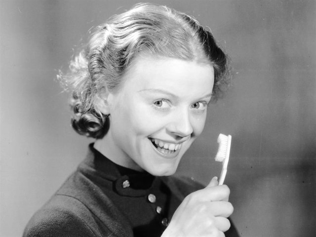 May 1936:  Miss Bampton with her toothbrush and toothpaste.