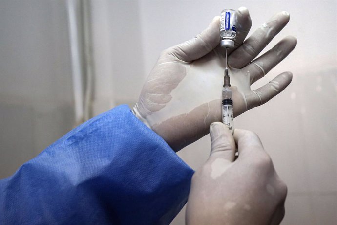 30 January 2021, Algeria, Blida: A medic fills a syringe from a vial containing the Russian-made Sputnik V COVID-19 vaccine at a clinic in Blida, a city located nearly 50 kilometres west of capital Algiers, where Algeria launched a national vaccination 