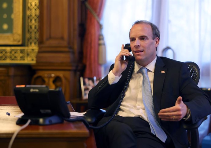 HANDOUT - 27 January 2021, United Kingdom, London: UK Foreign Secretary Dominic Raab makes a phone call with US Secretary of State Antony Blinken. Photo: Pippa Fowles/Downing Street/dpa - ATTENTION: editorial use only and only if the credit mentioned ab