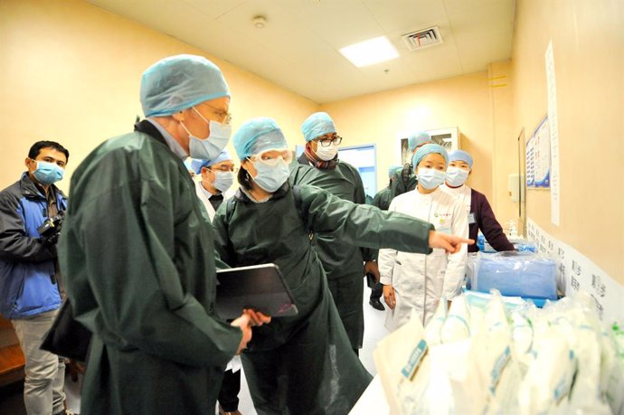 24 February 2020, China, Wuhan: Members of the coronavirus expert investigation group of the World Health Organization (WHO), conduct a field research in a hospital in the coronavirus-stricken Chinese city of Wuhan. Photo: -/TPG via ZUMA Press/dpa