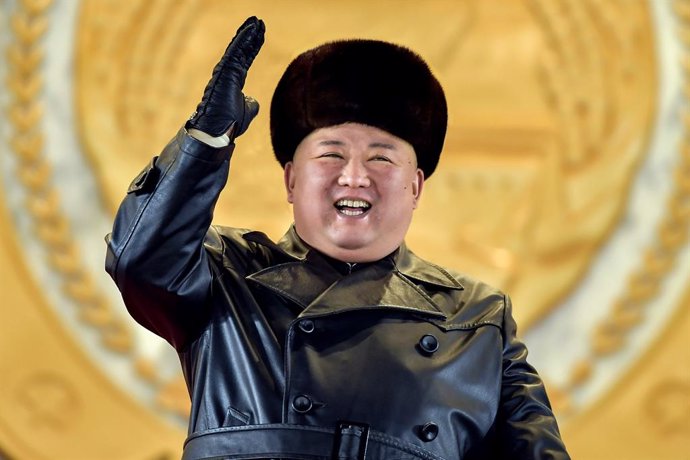 HANDOUT - 14 January 2021, North Korea, Pyongyang: A picture provided by the North Korean state news agency (KCNA) on 15 January 2021, shows North Korean leader Kim Jong-un acknowledging the crowd during a military parade at Kim Il-sung Square, to celeb