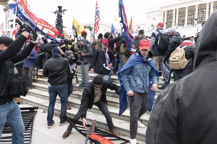 06 January 2021, US, Washington: Supporters of US President Donald Trump storm the USCapitol building during a Congress session to affirm President-elect Joe Biden's victory. Pro-Trump protesters stormed the USCapitol Building to interrupt Congress se