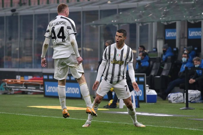 02 February 2021, Italy, Milan: Juventus' Cristiano Ronaldo celebrates scoring his side's second goal with teammate Dejan Kulusevski during the Coppa Italia semi-final first leg soccer match between Inter Milan and Juventus at the Giuseppe Meazza stadiu