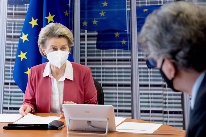 HANDOUT - 31 January 2021, Belgium, Brussels: European Commission President Ursula von der Leyen talks to EU commissioner for internal market Thierry Breton (R)during a video conference meeting with seven chief executives from pharmaceutical firms with