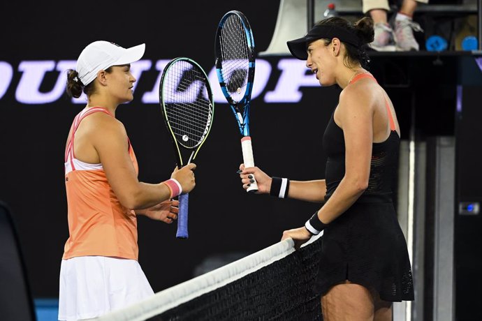 Ashleigh Barty of Australia (left) speaks to Garbine Muguruza of Spain after winning the Yarra Valley Classic - WTA 500 final match at Melbourne Park in Melbourne, Sunday, February 7, 2021. (AAP Image/Dave Hunt) NO ARCHIVING, EDITORIAL USE ONLY