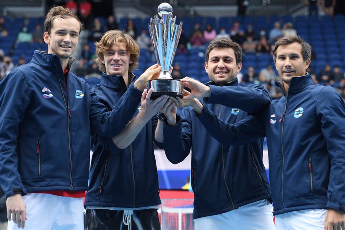 Team Russia hold the trophy after winning the ATP Cup final against Team Italy on Rod Laver Arena at Melbourne Park in Melbourne, Sunday, February 7, 2021. (AAP Image/Dean Lewins) NO ARCHIVING, EDITORIAL USE ONLY