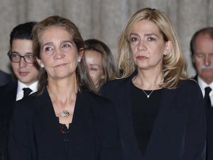 Princess Elena of Spain and Princess Cristina of Spain pay their respects at El Escorial Monastery for a Corpore Insepulto Mass of Spain's Duke of Calabria, Carlos de Borbon Dos Sicilias on October 8, 2015 in San Lorenzo de El Escorial, Spain.