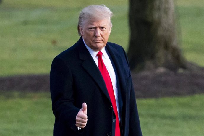 December 18, 2019 - Washington, DC USA: US President Donald J. Trump gestures while walking across the South Lawn of the White House to depart by Marine One en route to Michigan for a rally; in Washington, DC, USA, 18 December 2019. The US House of Repr