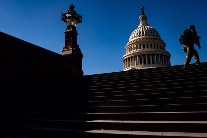 WASHINGTON, DC - FEBRUARY 08: National Guard troops walk up stairs from the Capitol Visitors center with the dome of the U.S. Capitol Building in the background on Monday, Feb. 8, 2021 in Washington, DC. The Senate is scheduled to begin the second impea