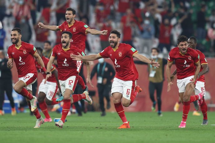 11 February 2021, Qatar, Ar-Rayyan: Al Ahly players celebrate after winning the penalty shoot-out of the FIFA Club World Cup Third Place soccer match between Al Ahly SC and Sociedade Esportiva Palmeiras at the Education City Stadium. Photo: Mahmoud Hefn