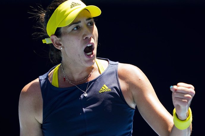 Garbine Muguruza of Spain celebrates after winning her third Round Women's singles match against Zarina Diyas of Kazakhstan on Day 5 of the Australian Open at Melbourne Park in Melbourne, Friday, February 12, 2021. (AAP Image/Dave Hunt) NO ARCHIVING, ED
