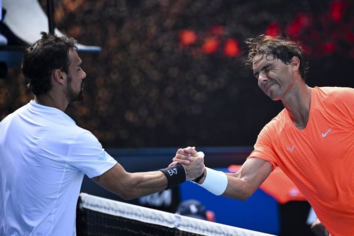 Rafael Nadal of Spain (right) is congratulated by Fabio Fognini of Italy after winning his fourth Round Men's singles match on Day 8 of the Australian Open at Melbourne Park in Melbourne, Monday, February 15, 2021. (AAP Image/Dean Lewins) NO ARCHIVING, 