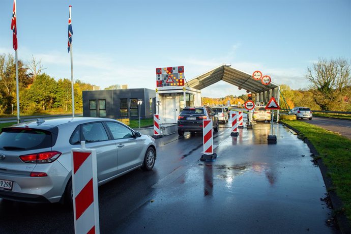 24 October 2020, Schleswig-Holstein, Flensburg: Vehicles drive past the borders near Flensburg from Germany into Denmark. As of Saturday entry from Germany has been subjected to restrictions after Denmark declared Germany as a risk country amid the risi