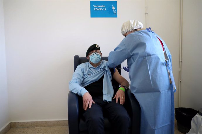 13 February 2021, Portugal, Lisbon: A National Republican Guard officer receives a first dose of the AstraZeneca Covid-19 vaccine on the first day of the security forces inoculation at the Conde de Lippe military barracks. Photo: Pedro Fiuza/ZUMA Wire/d