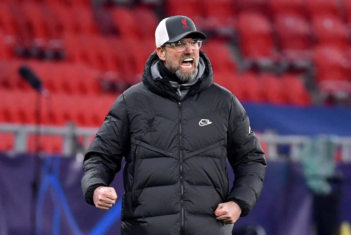 16 February 2021, Hungary, Budapest: Liverpool manager Jurgen Klopp reacts during the UEFAChampions League round of 16 first leg soccer match between RB Leipzig and FC Liverpool at Puskas Arena. Photo: Marton Monus/dpa