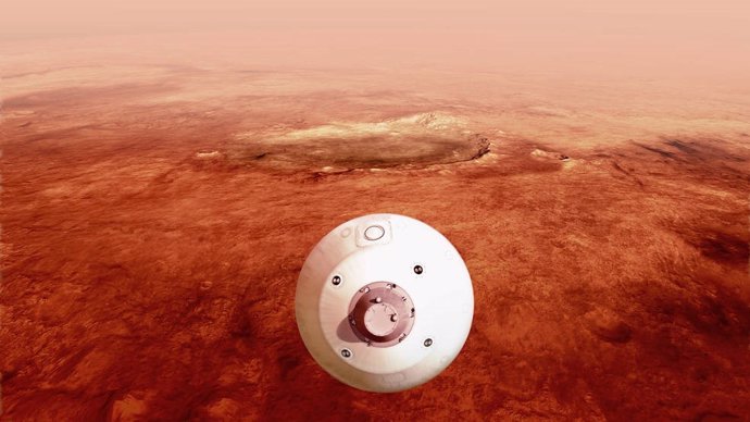El aerocaparazón que contiene el rover Perseverance de la NASA se guía hacia la superficie marciana a medida que desciende a través de la atmósfera en esta ilustración.