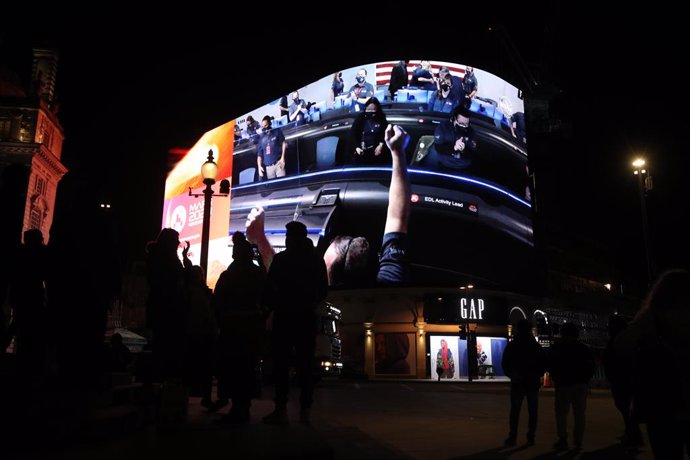 18 February 2021, United Kingdom, London: Images from Nasa of the landing of NASA's Perseverance on Mars is live streamed on Piccadilly Lights in central London. 