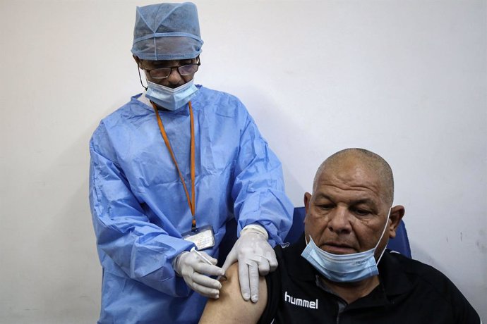 30 January 2021, Algeria, Blida: A man receives a dose of the Russian-made Sputnik V COVID-19 vaccine at a clinic in Blida, a city located nearly 50 kilometres west of capital Algiers, where Algeria launched a national vaccination campaign, starting in 