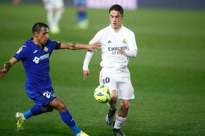 Sergio Arribas of Real Madrid and Damian Suarez of Getafe in action during the spanish league, La Liga Santander, football match played between Real Madrid and Getafe CF at Ciudad Deportiva Real Madrid on february 09, 2021, in Valdebebas, Madrid, Spain.