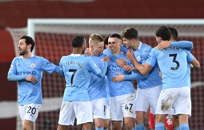07 February 2021, United Kingdom, Liverpool: Manchester City's Phil Foden celebrates scoring his side's fourth goal with his team mates  during the English Premier League soccer match between Liverpool and Manchester City at Anfield. Photo: Laurence Gri
