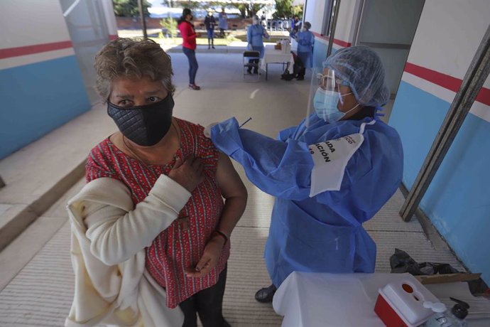 16 February 2021, Mexico, Etzatlan: A woman receives a dose of coronavirus (Covid-19) vaccine during the vaccination campaign for adults over 60 years in the State of Jalisco. Photo: -/El Universal via ZUMA Wire/dpa