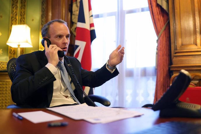 HANDOUT - 27 January 2021, United Kingdom, London: UK Foreign Secretary Dominic Raab makes a phone call with US Secretary of State Antony Blinken. Photo: Pippa Fowles/Downing Street/dpa - ATTENTION: editorial use only and only if the credit mentioned ab