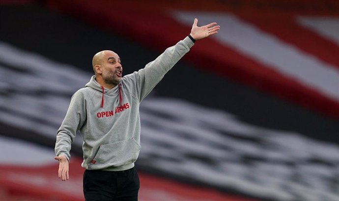 21 February 2021, United Kingdom, London: Manchester City manager Pep Guardiola reacts on the touchline during the English Premier League soccer match between Arsenal and Manchester City at the Emirates Stadium. Photo: John Walton/PA Wire/dpa