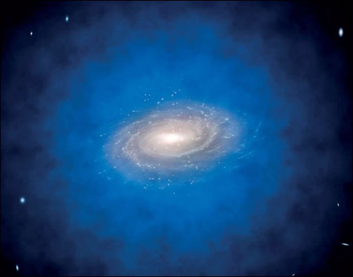 Impresión artística de una galaxia espiral incrustada en una distribución más grande de materia oscura invisible, conocida como halo de materia oscura (de color azul).