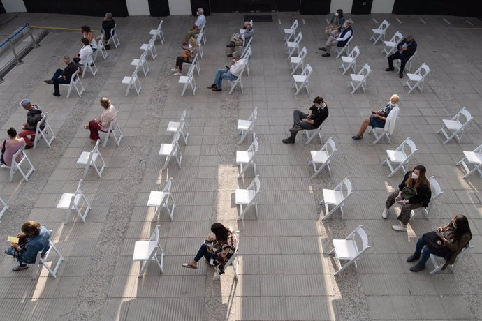 11 February 2021, Chile, Santiago: People wait to receive a dose of the Sinovac coronavirus vaccine, in the second week of mass vaccination, at a vaccination centre. Photo: Matias Basualdo/ZUMA Wire/dpa