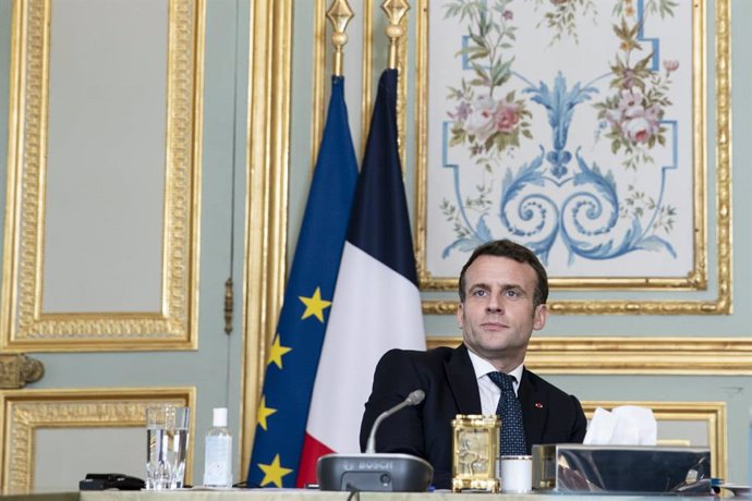 HANDOUT - 25 February 2021, France, Paris: French President Emmanuel Macron takes part via videolink in a special EU summit of heads of state and governments on the Coronavirus pandemic. Photo: -/European Council/dpa - ATTENTION: editorial use only and 