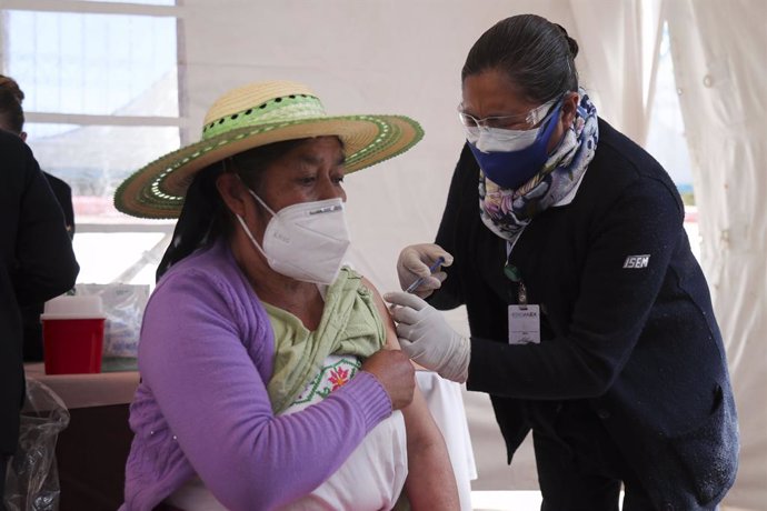 15 February 2021, Mexico, Toluca: A woman receives a dose of AstraZeneca coronavirus (Covid-19) vaccine during the vaccination campaign for adults over 60 years in the State of Mexico. Photo: Jorge Alvarado/El Universal via ZUMA Wire/dpa